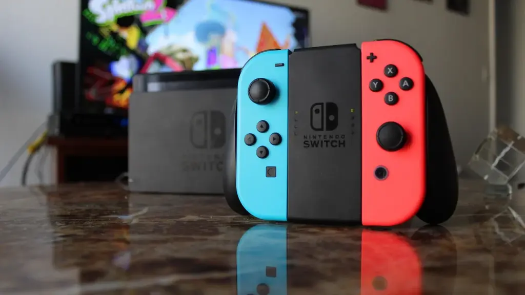 A close-up of a game controller and console setup that evokes a Switch-like design.