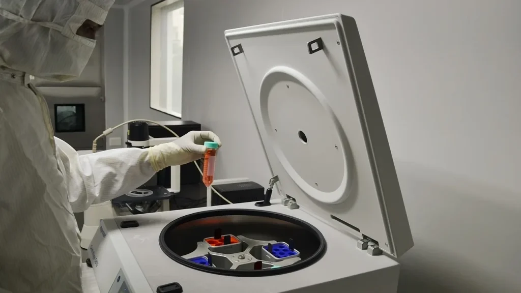 A modern biotech lab with scientists and lab equipment