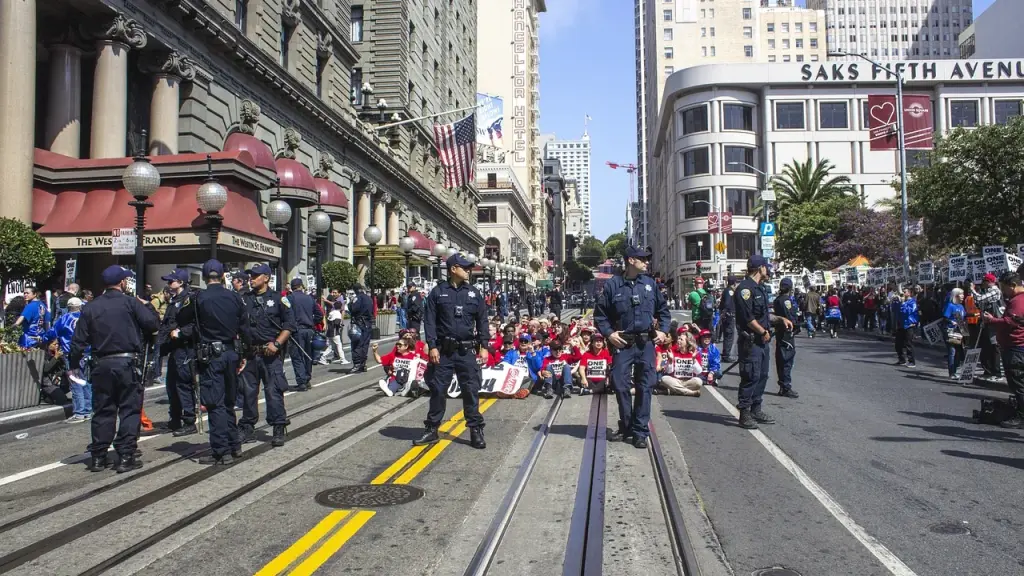 A street scene with people gathered for an event or rally