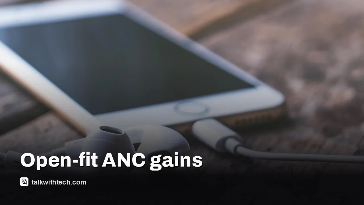 Open-fit wireless earbuds on a table