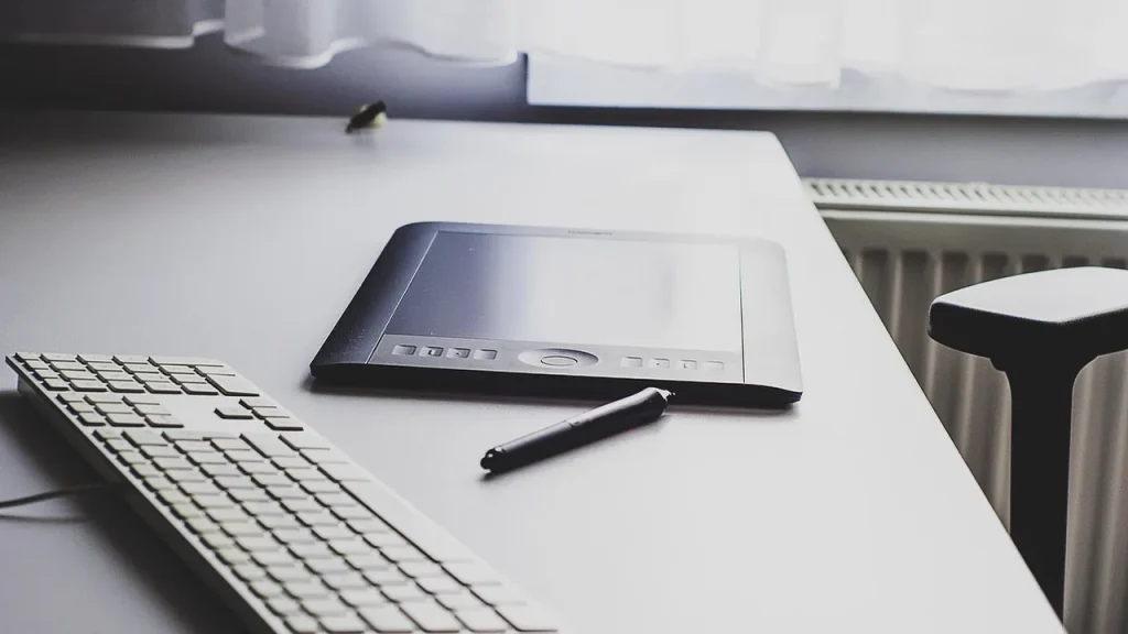 Tablet with keyboard and stylus laid out for productivity