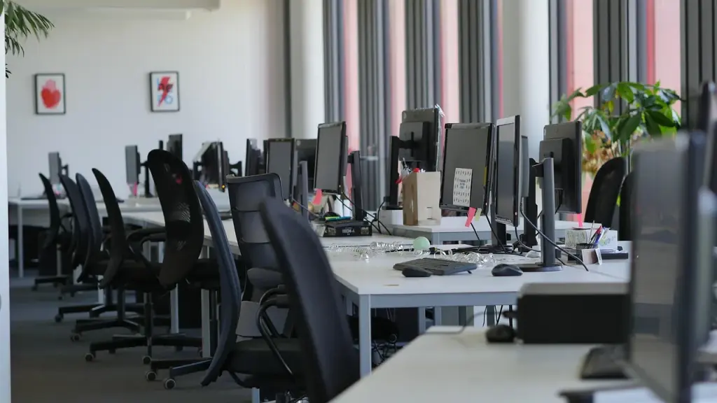 Empty desks in an open-plan office in the evening