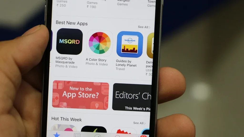 A smartphone displaying a row of indie game icons on the App Store