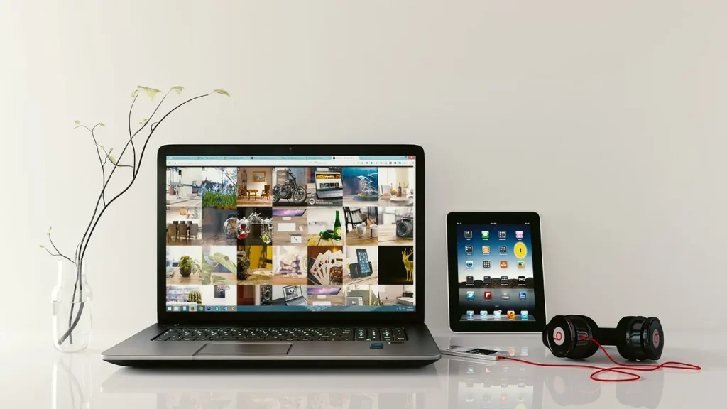 A compact tablet resting on a desk with a keyboard nearby