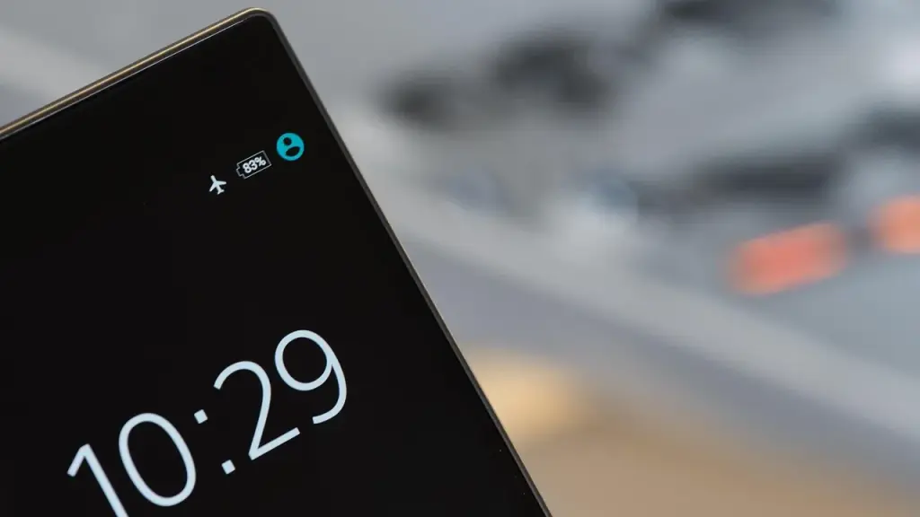Phone home screen showing dark-mode widgets