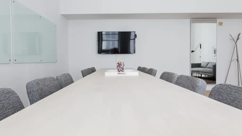 Business people in a conference room reviewing documents