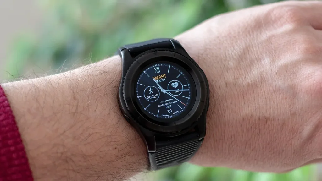 Chest strap heart-rate monitor and smartwatch on a runner