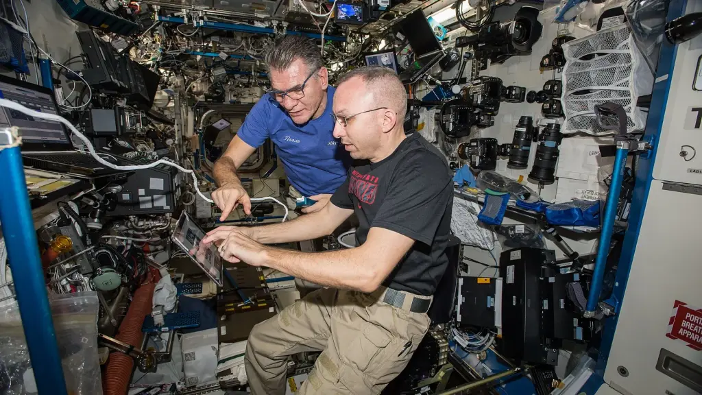 Astronauts training for docking procedures in a simulator