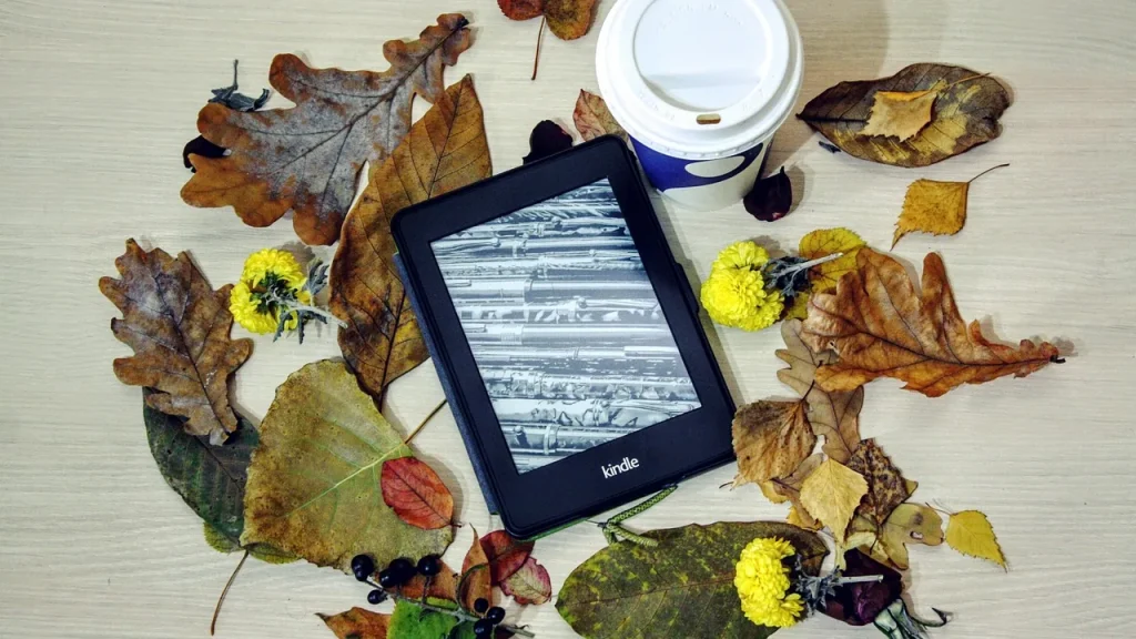 A modern e-reader on a table with soft lighting