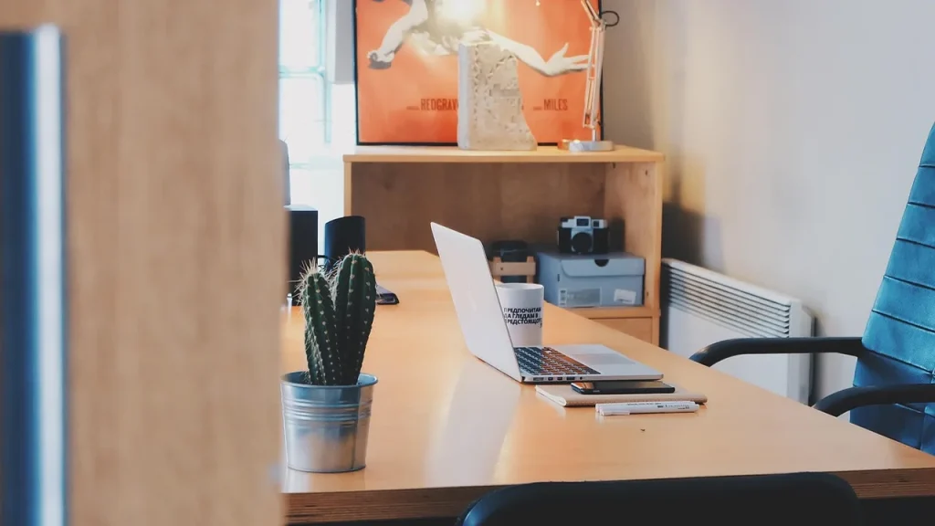 A modern laptop open on a desk showing a productivity screen