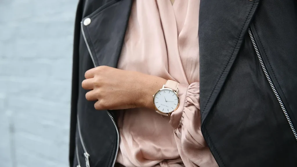 A wearable fitness watch on a wrist with health data
