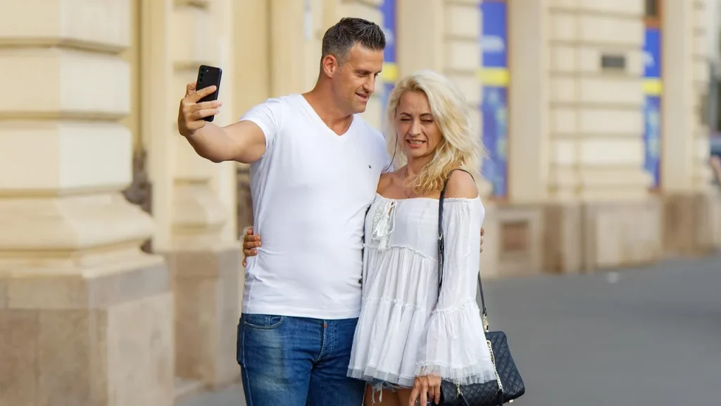 Two people using smartphones in a casual setting