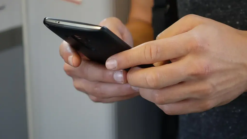 person using banking app on smartphone at home