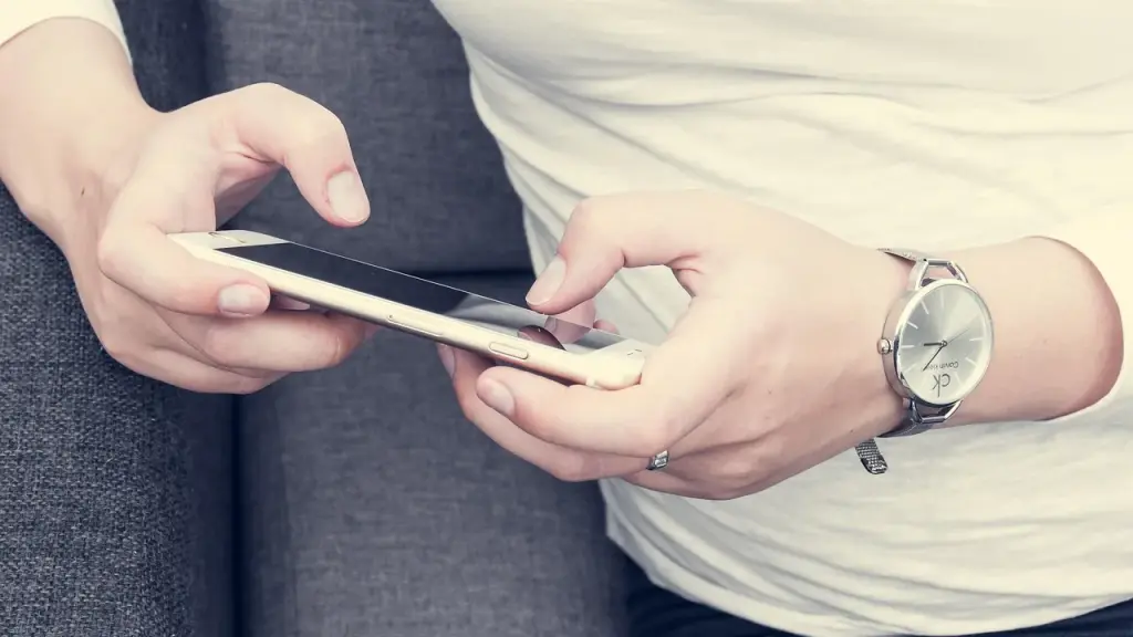 hands holding a smartphone with chat bubbles