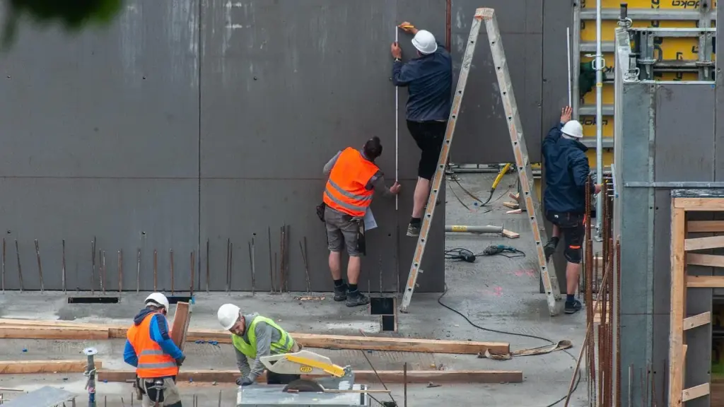A busy construction site with workers in hard hats
