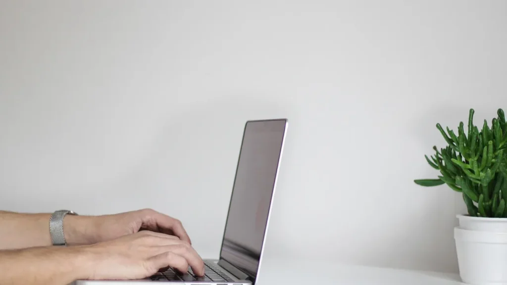 laptop showing a USB-C connected wireless HDMI transmitter