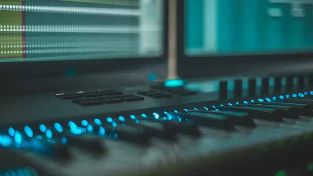 Hardware synthesizer with cables on a studio rack