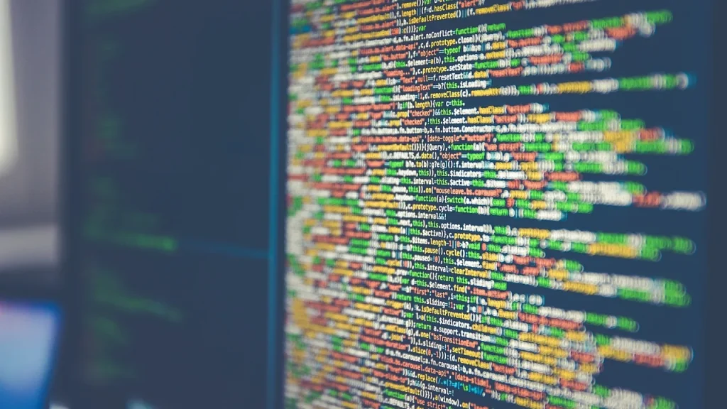 Screen showing code alongside an AI assistant dashboard