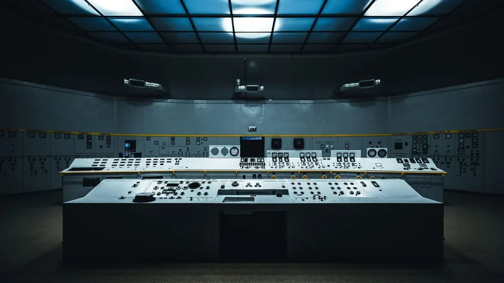 Control room with screens and security gear