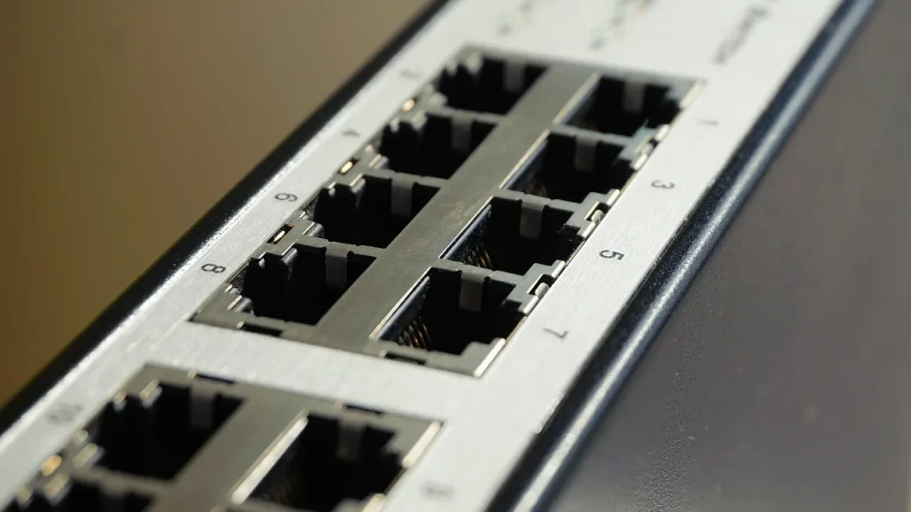 Rows of server racks and network cables inside a data center.