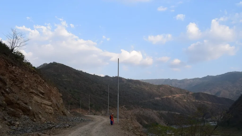 Rail or road corridor with deterrence devices nearby