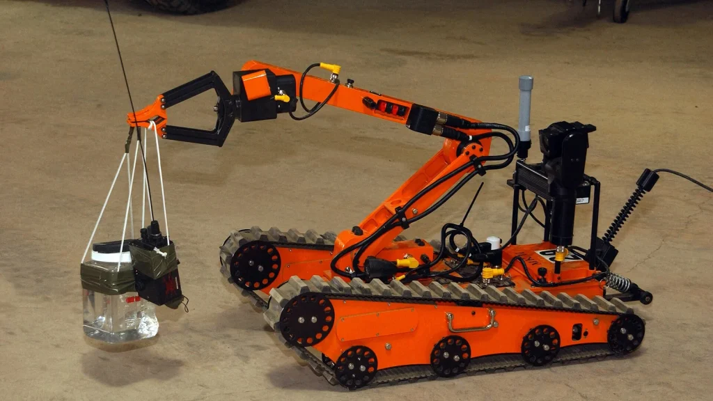 Robotic claw sorting items on a conveyor belt