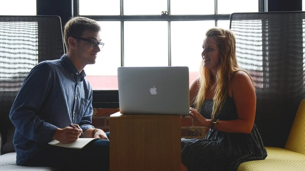 Startup team discussing a prototype in a lab setting