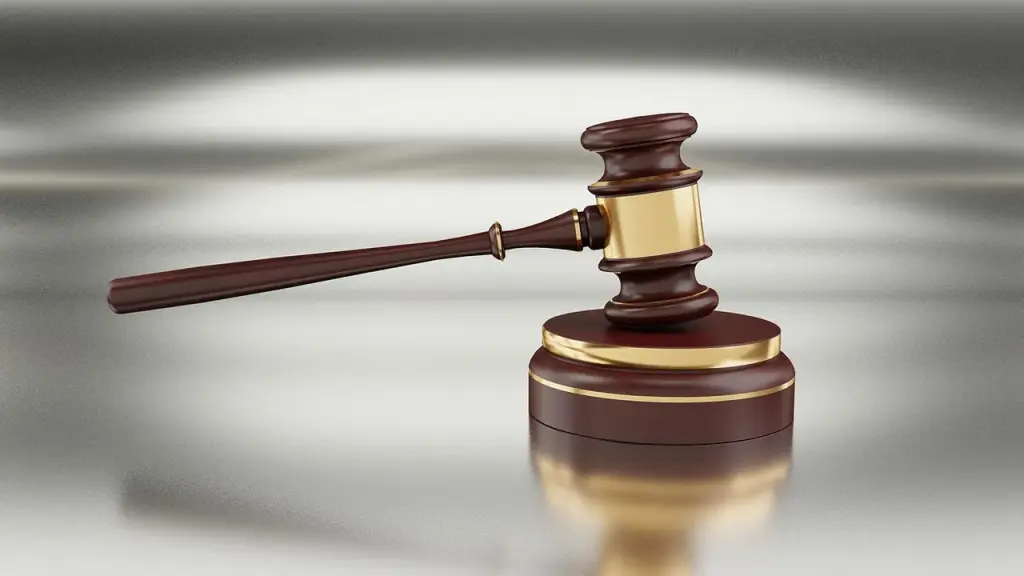 Court gavel on top of legal documents.