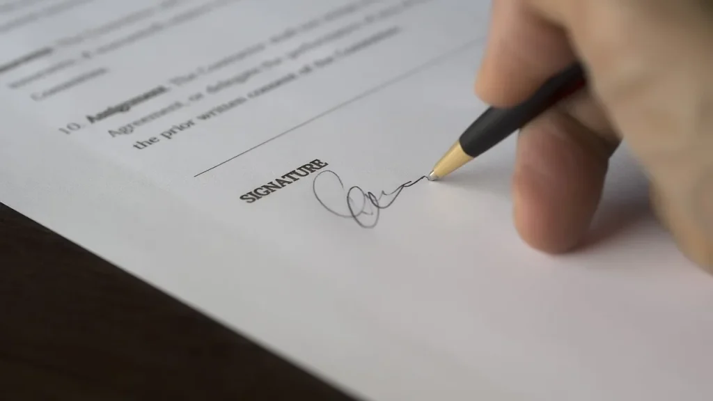 Close-up of hands handling forms