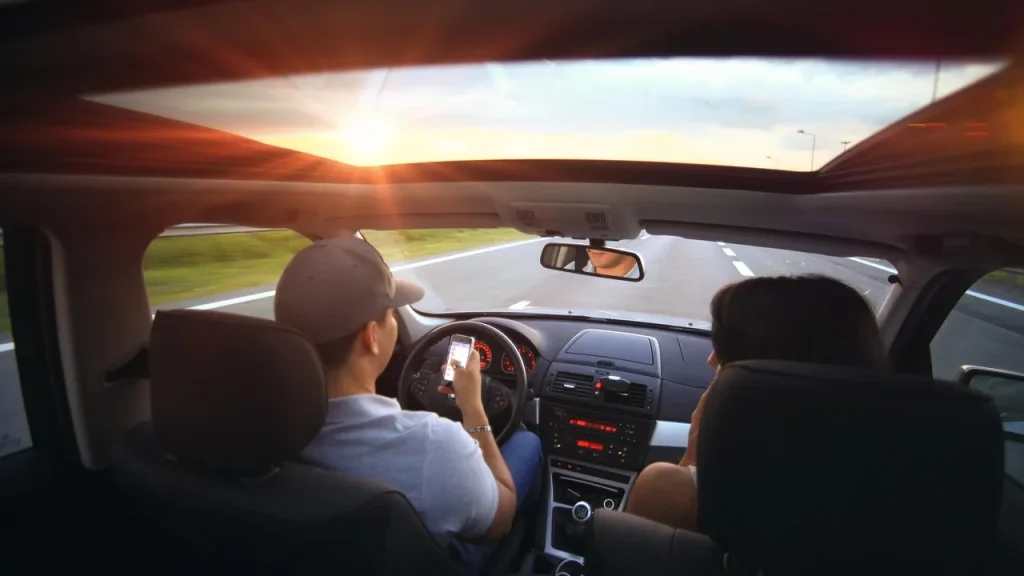 Car on highway with dashboard showing speed
