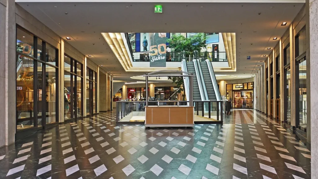 Storefronts of clothing brands in a shopping district