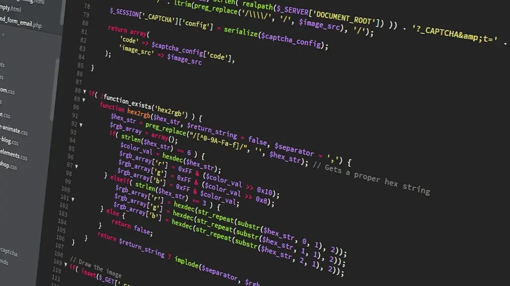 Close-up of a computer screen showing design assets and code blocks