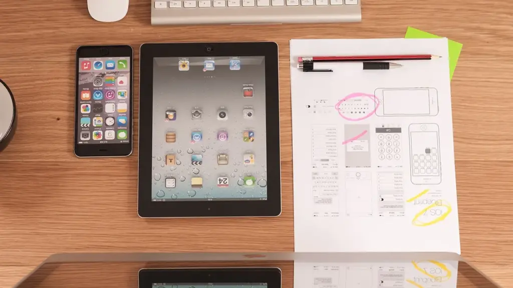 A hand using a tablet to review a design prototype