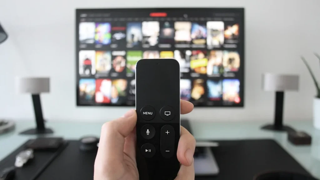 Remote and a TV displaying a streaming app