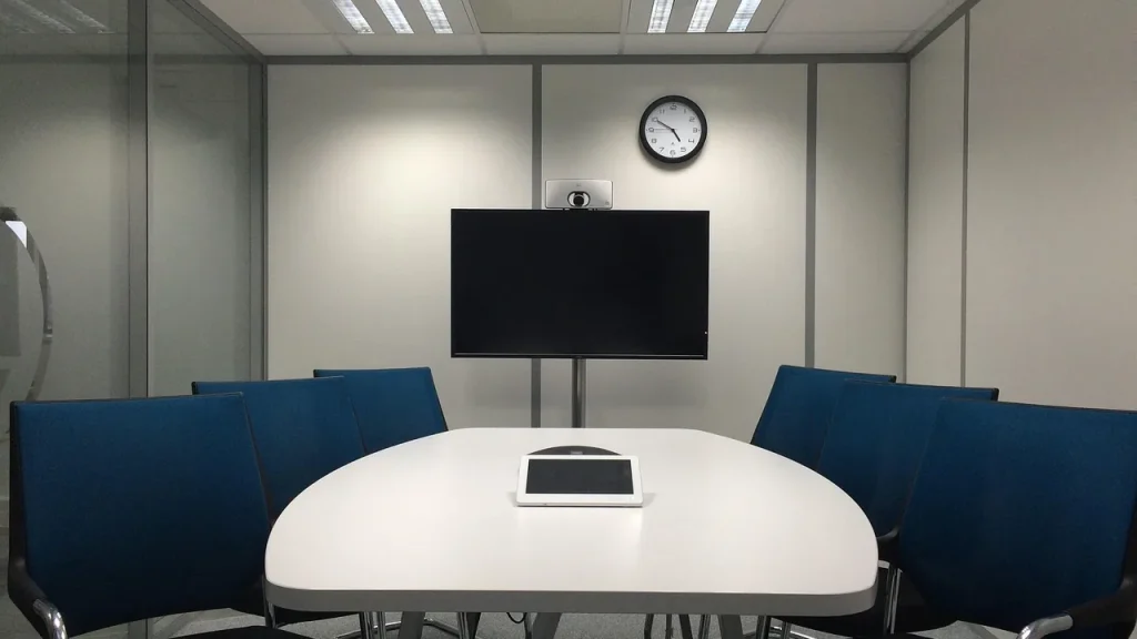 Boardroom with executives discussing a presentation