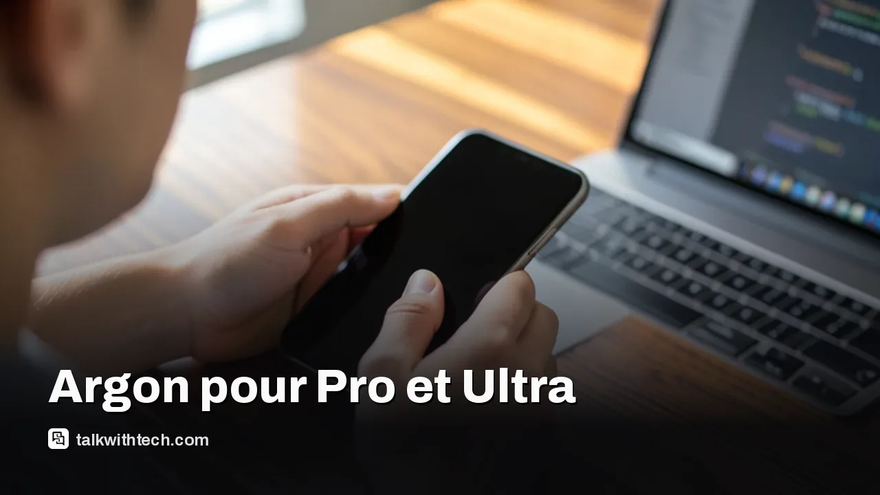 Mains utilisant smartphone et ordinateur portable sur un bureau, écrans sombres, lumière du matin.