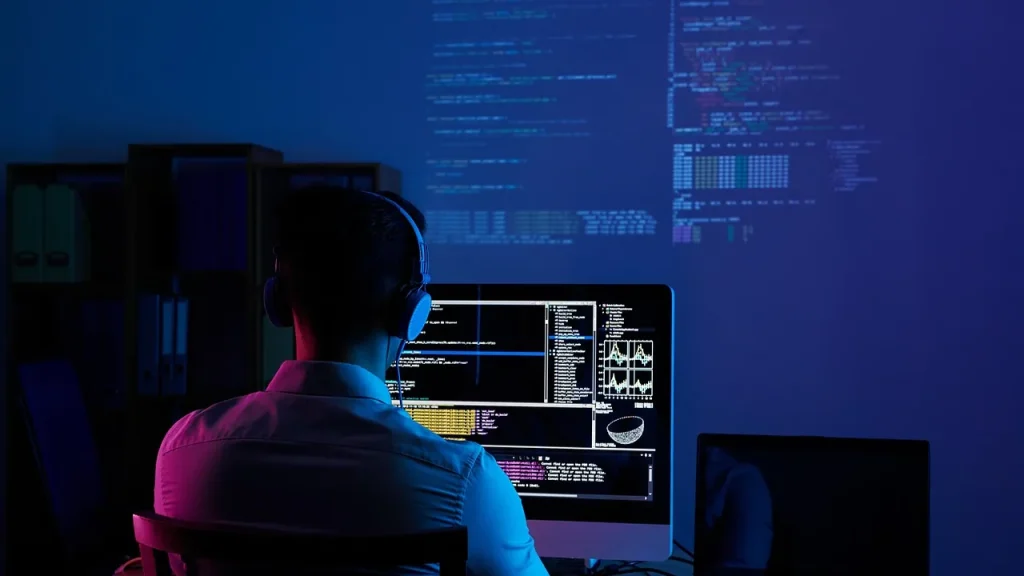 developer working at a computer with code on screen