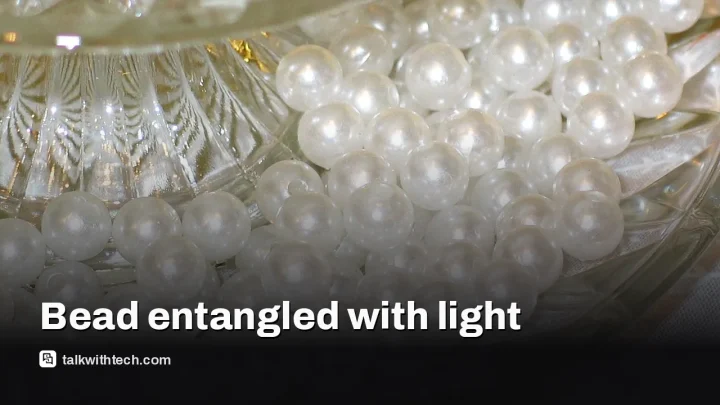 Glass bead entangles with light in a step toward quantum memory