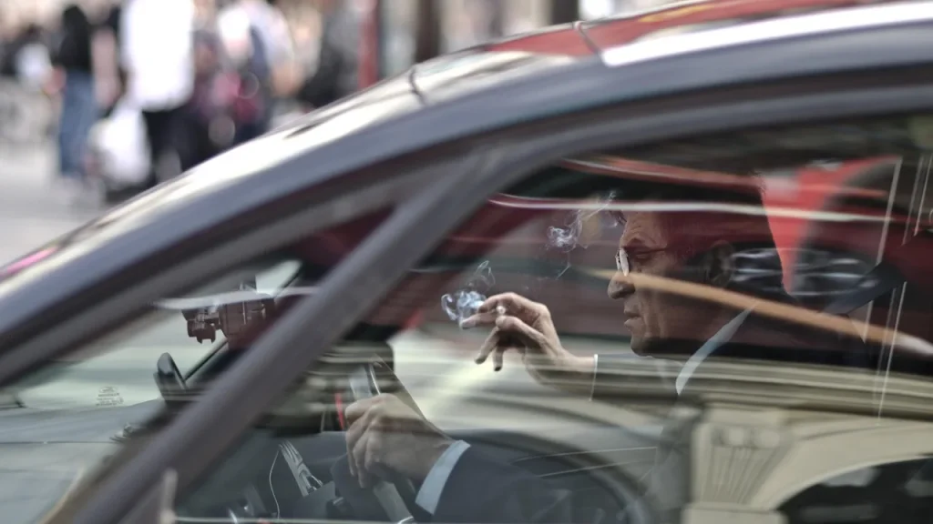Close up of a hand navigating a car's infotainment settings