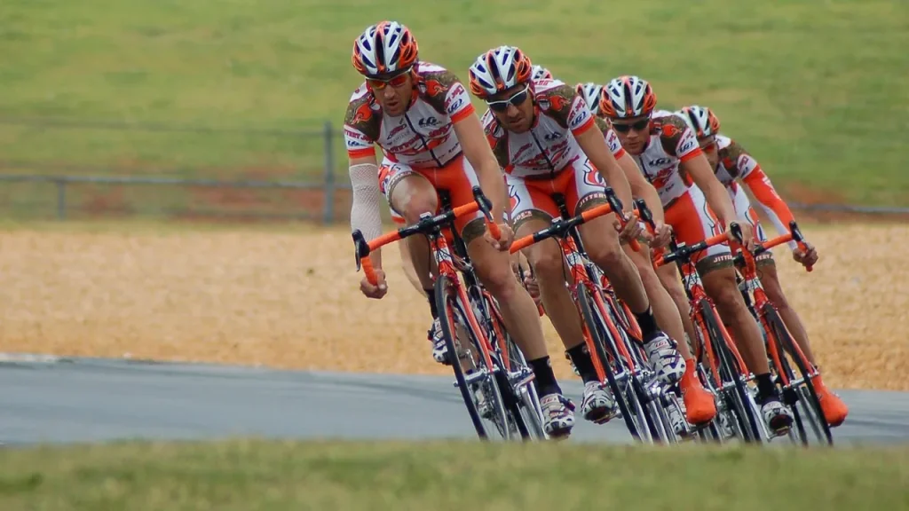 racing on gravel course with bikes and spectators