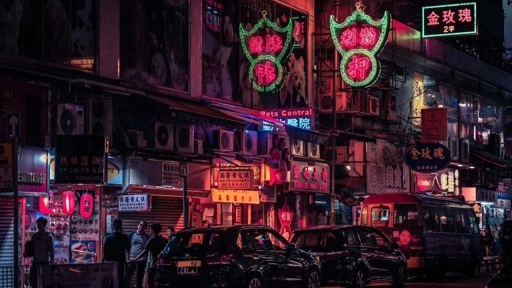 Urban street at night with lights and a sense of anticipation