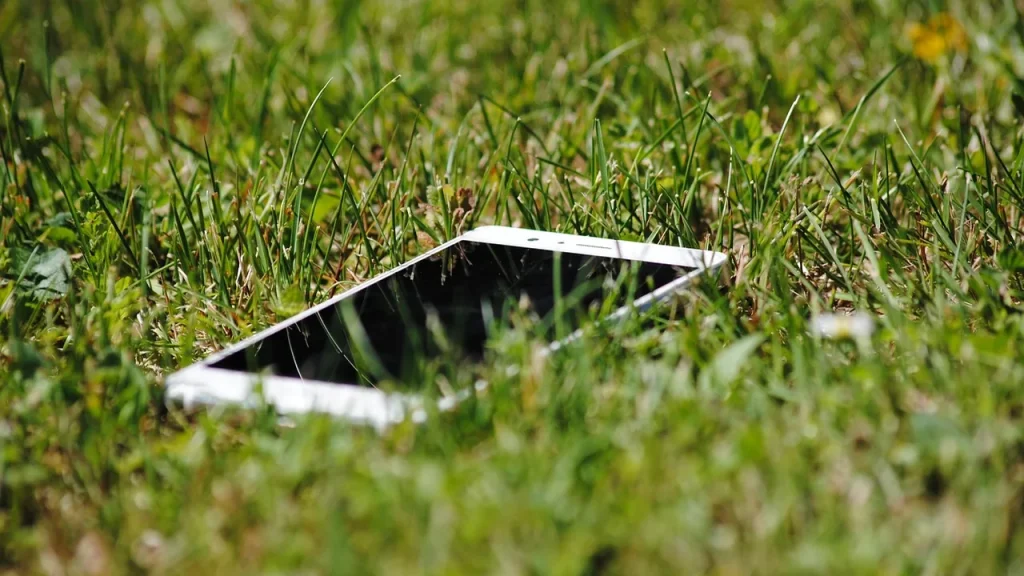 Smartphone showing a lawn-mapping app in use