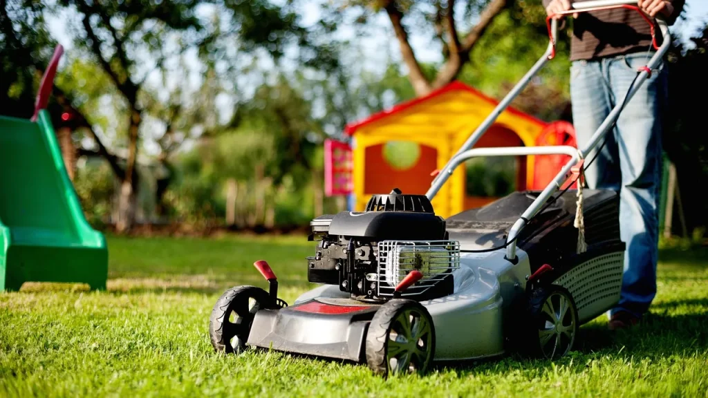 Robot lawn mower in a driveway ready to mow