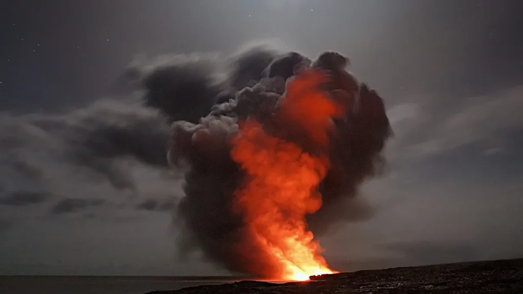 Volcanic landscape with crater and hazy sky at dawn