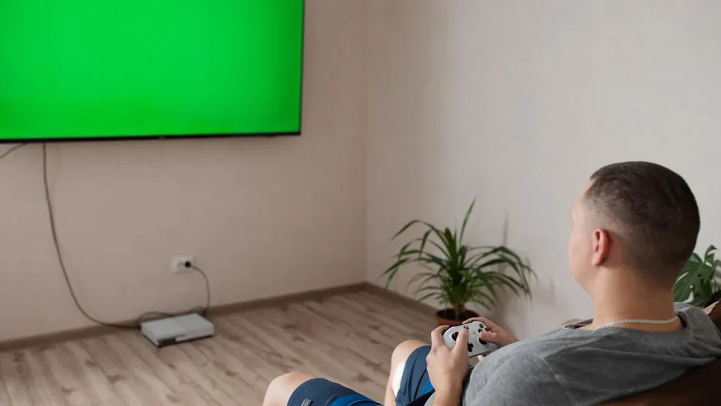 A living room setup with a console connected to a TV for local co-op gaming