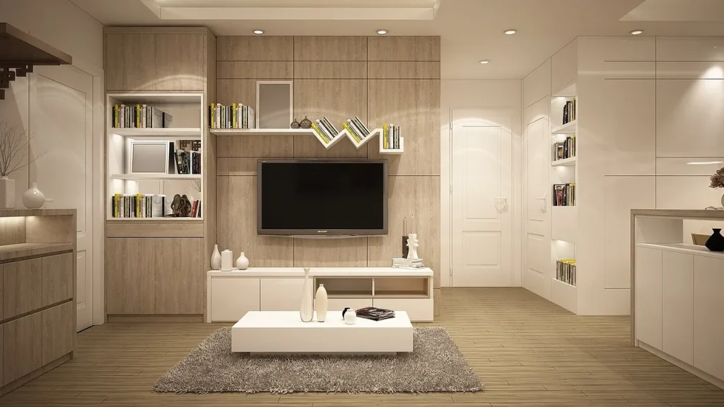 Living room with cushions and a TV showing a film