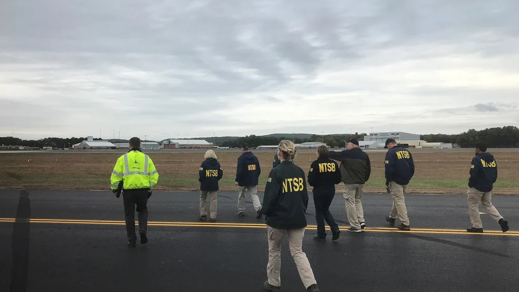 Airport security or investigators at a terminal after a flight incident.