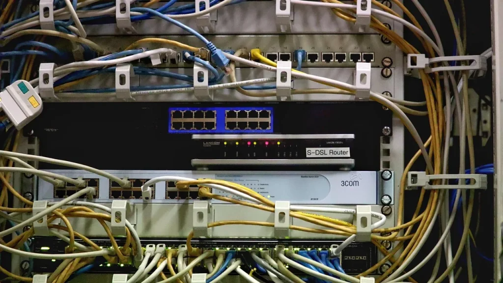 Rows of network equipment and cables in a data center