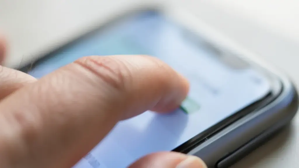Thumb tapping a switch on a phone settings screen