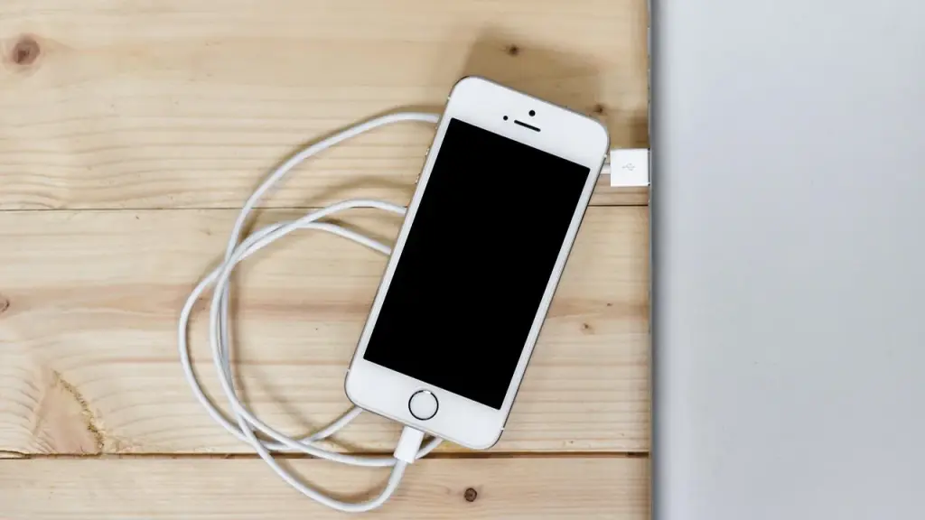 Smartphone charging on desk